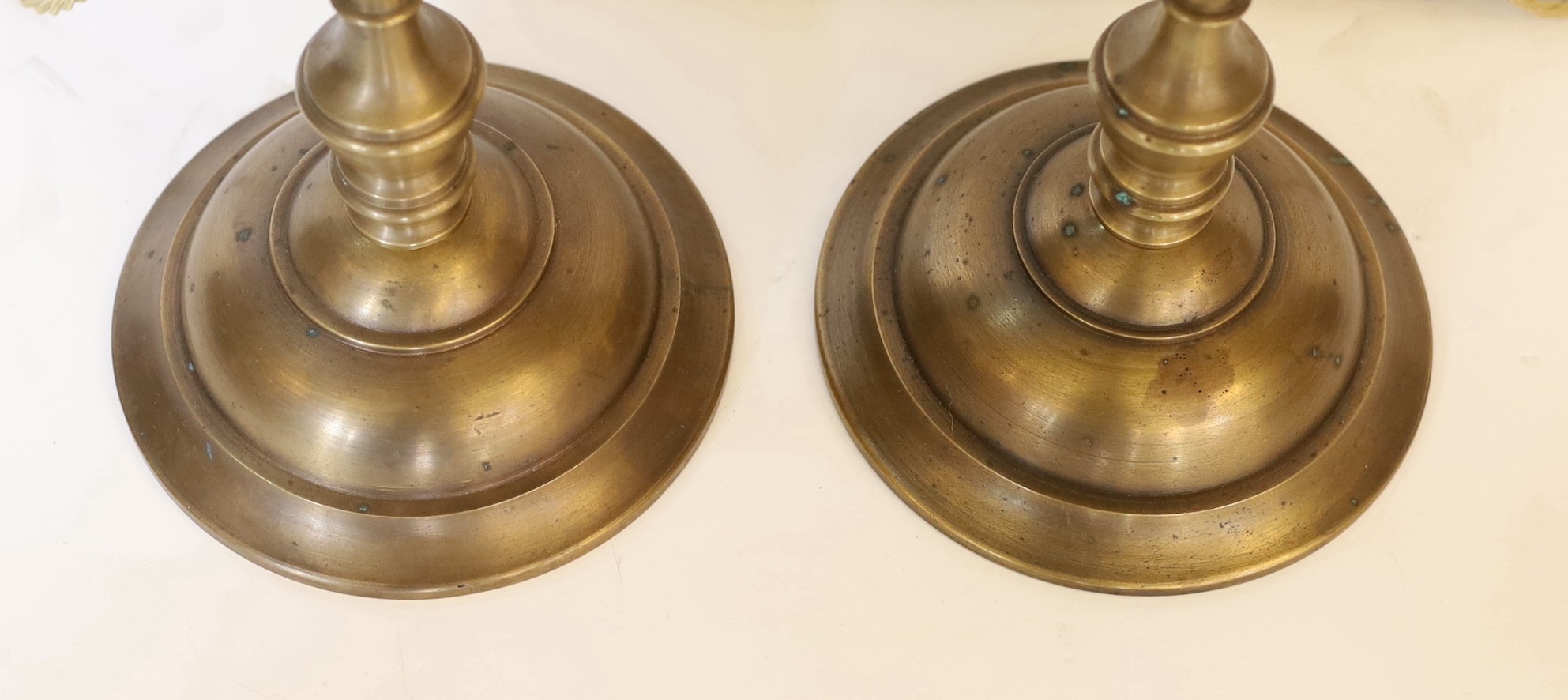A pair of Edwardian style brass desk lamps with loetz style glass shades, height 61cm